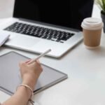 close up hand of female graphic designer sketching g9p89yt