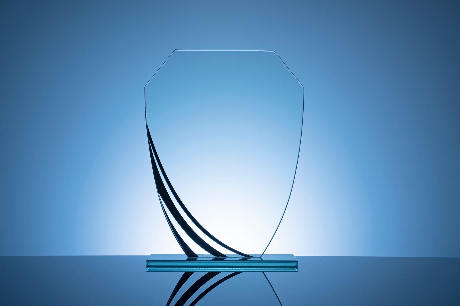 elegant blank glass shield trophy on dark blue 2026 01 07 02 23 10 utc.jpg